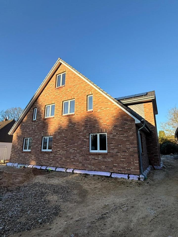 Wohnung mit Haus-Charakter: Energie Effizienter Neubau mit Garten